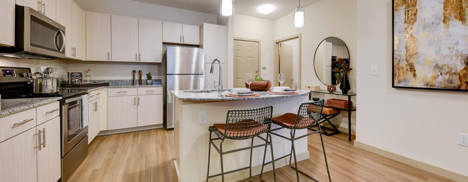 a kitchen with white cabinets