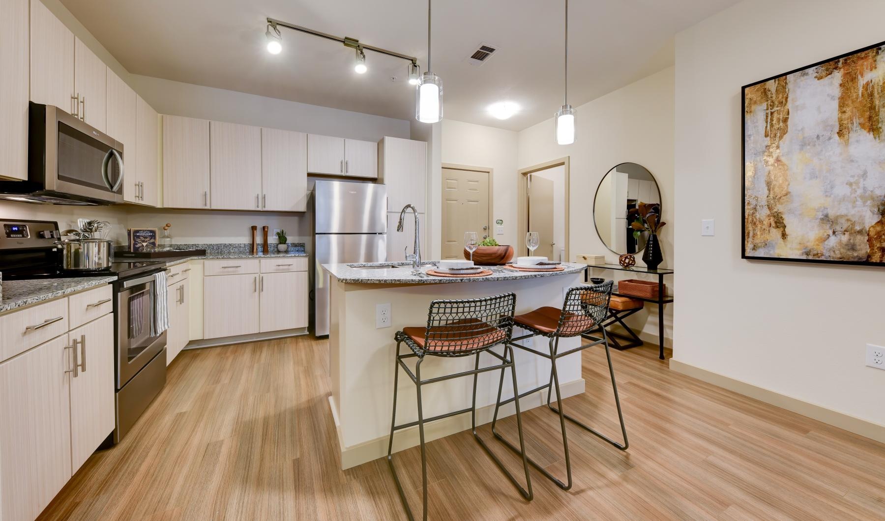 a kitchen with white cabinets