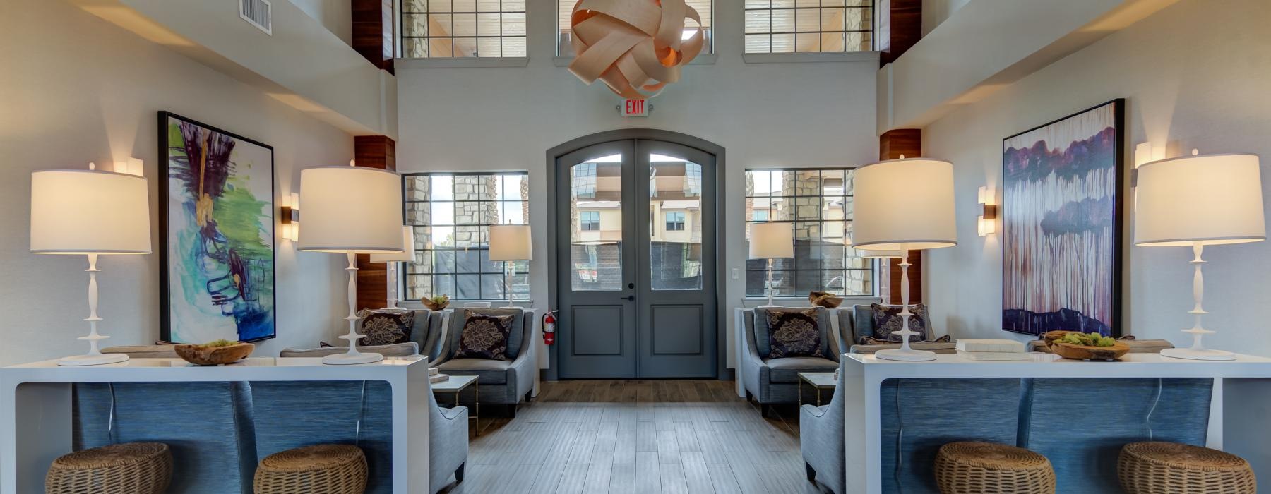 a room with a pool table and chairs