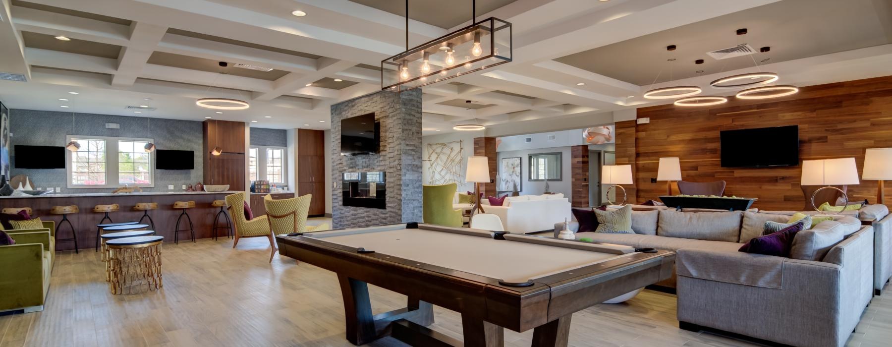 Beautiful clubroom with lounge seating and billiards areas